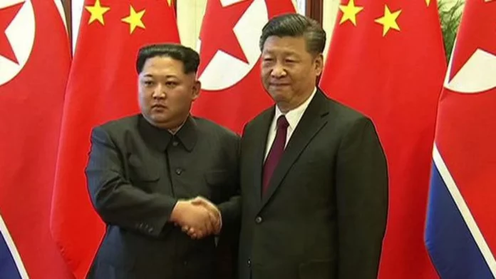 Kim et Poutine aux côtés du président chinois pour un défilé militaire géant